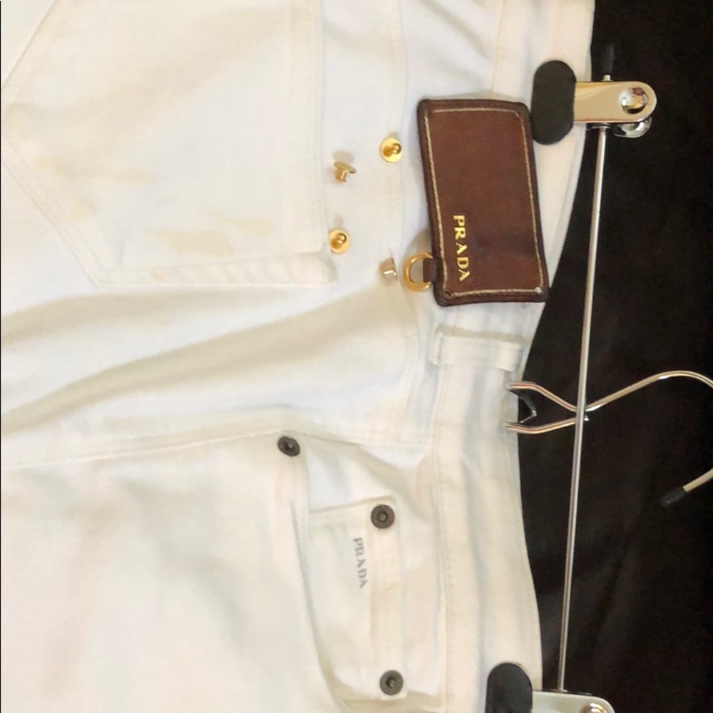 White Prada jeans, with removable label.